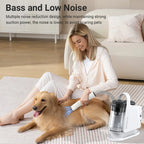 Woman grooming a dog with a pet grooming tool in a living room setting