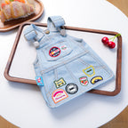 Small dog wearing vintage badge denim skirt — fun pet fashion | Pawnests